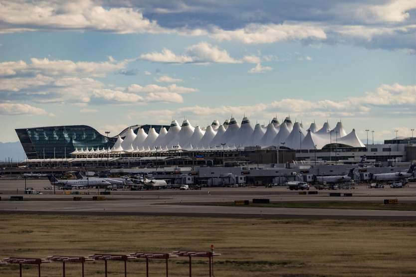 Exterior of Denver International Airport with airplanes on the tarmac